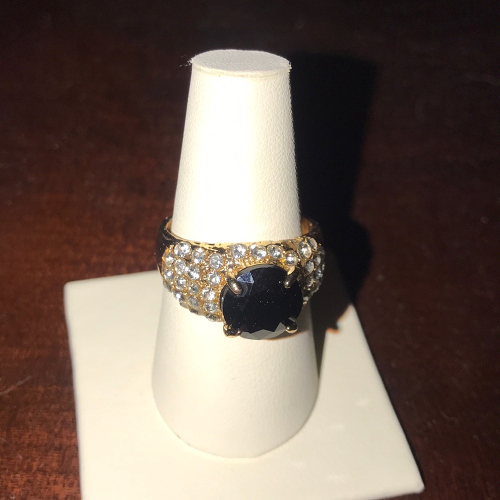 Gold ring with black center stone